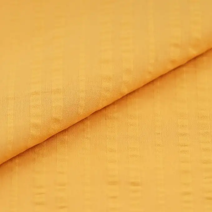 Tessuto seersucker cotone giallo tinta unita