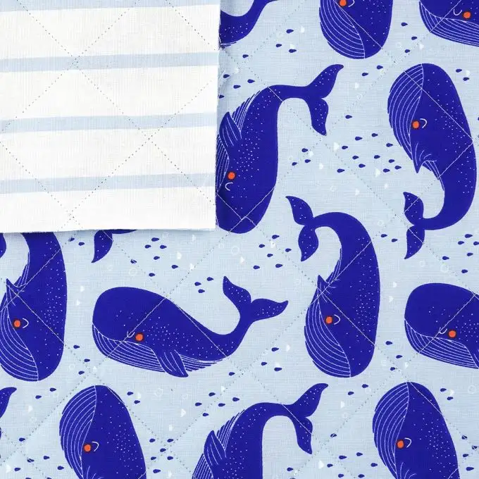 Tessuto trapuntato blu balene