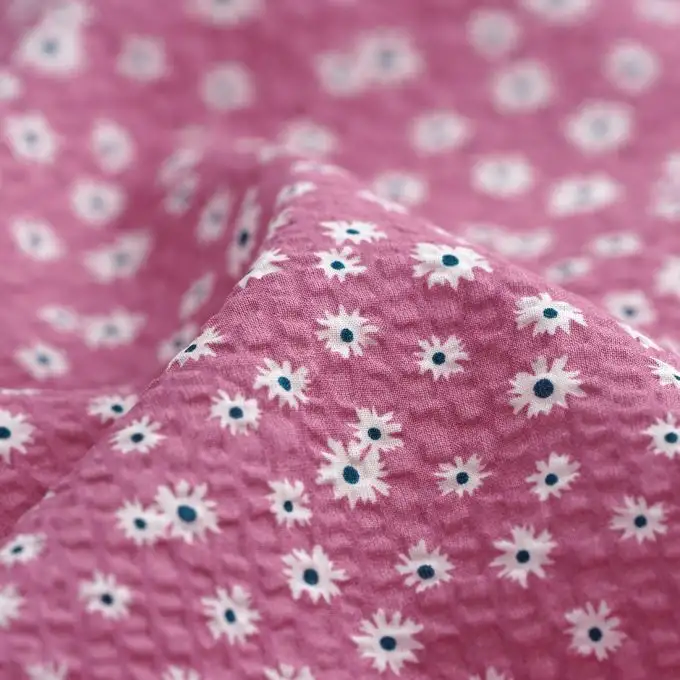 Tessuto seersucker cotone margherita malva