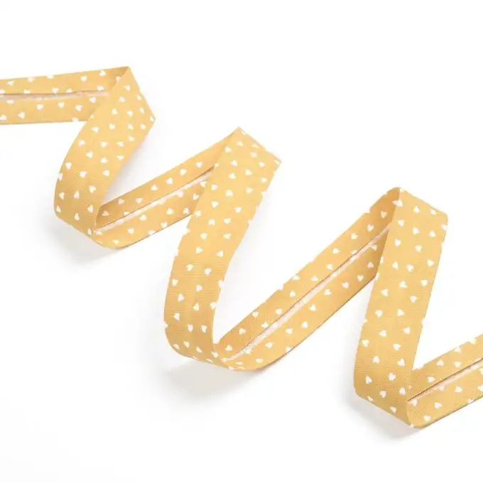 Bordo in cotone stampa piccolo cuore ecru e giallo autunno